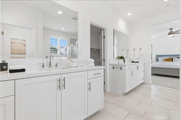 a view of a hallway with white walls and stairs