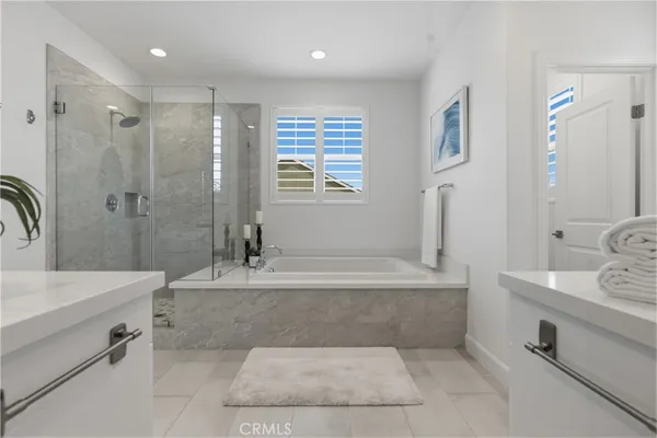 a view of a hallway with wooden floor and closet