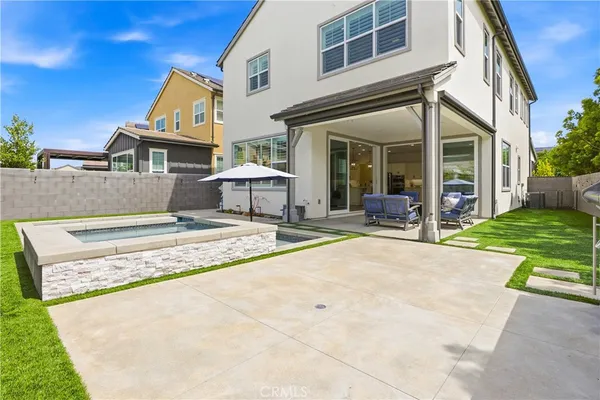 a view of a house with sitting area and furniture