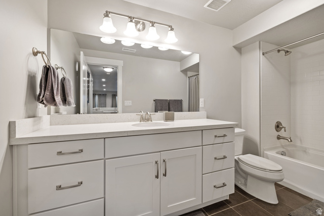 2745 Red Barn Road South Heber City, UT 84032 - Photo 30 of 51 Full bath featuring vanity, shower / bathtub combination with curtain, and dark tile patterned flooring
