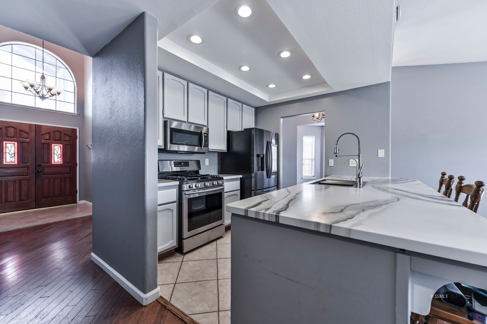 633 East Church Avenue Ridgecrest, CA 93555 - Photo 10 of 27 a kitchen with stainless steel appliances granite countertop a sink refrigerator and microwave