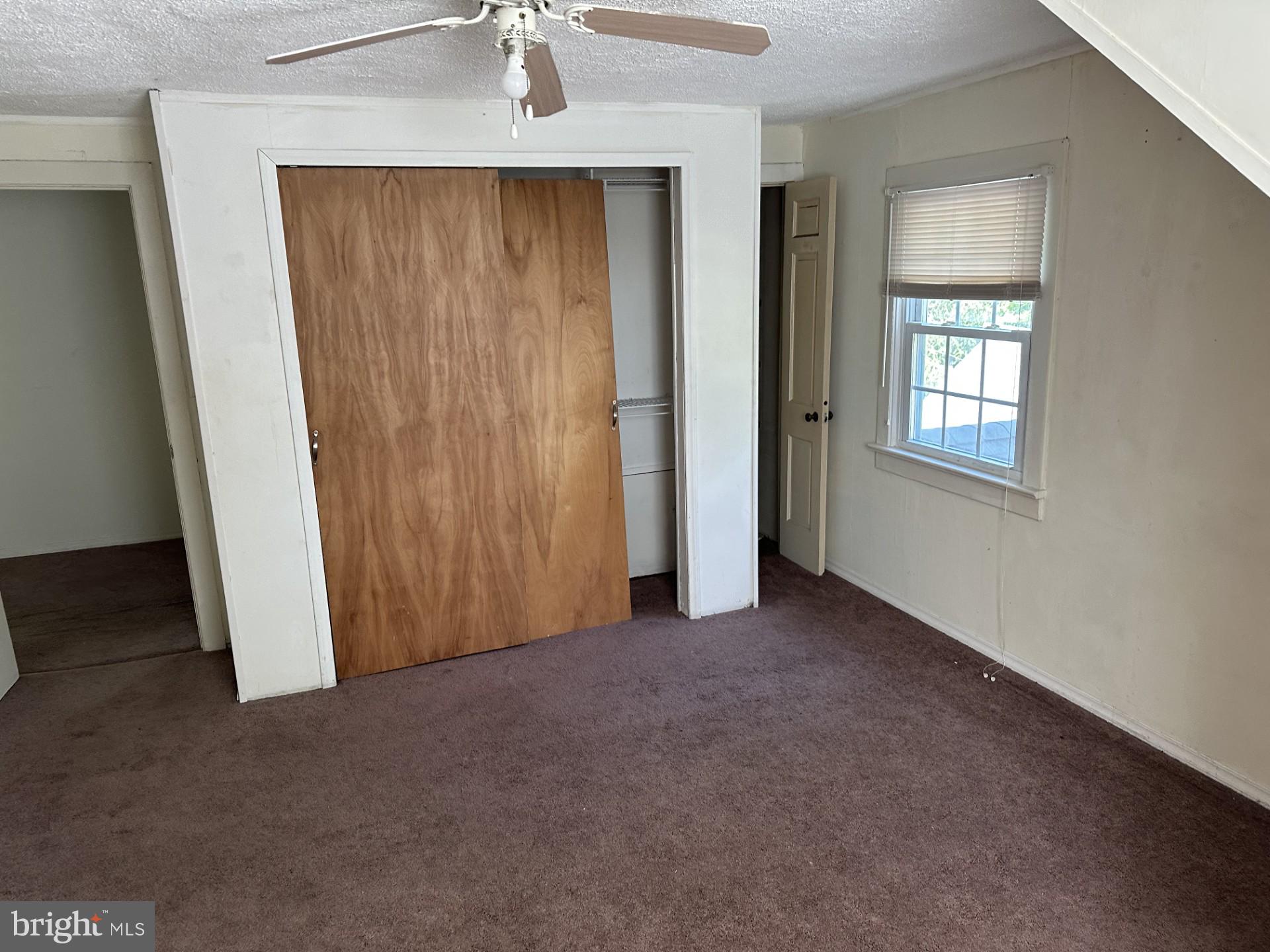 317 Magnolia Road Pemberton, NJ 08068 - Photo 19 of 42 an empty room with windows and closet