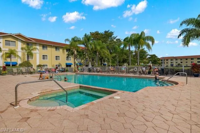 a view of a swimming pool with a patio