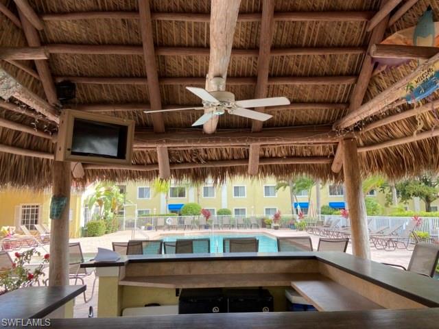 8234 Key Royal Circle, Unit 533 Naples, FL 34119 - Photo 19 of 24 a kitchen with a table and chairs in it