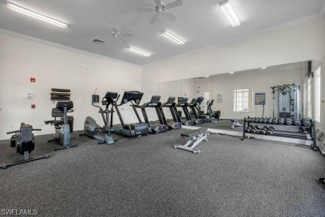 8234 Key Royal Circle, Unit 533 Naples, FL 34119 - Photo 21 of 24 a view of a room with gym equipment