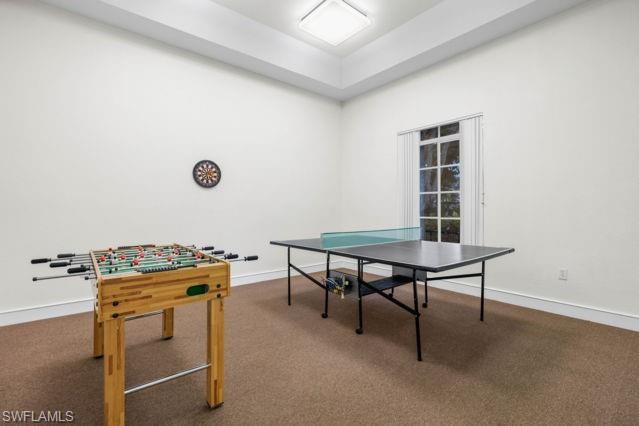 8234 Key Royal Circle, Unit 533 Naples, FL 34119 - Photo 22 of 24 a room with furniture and a window