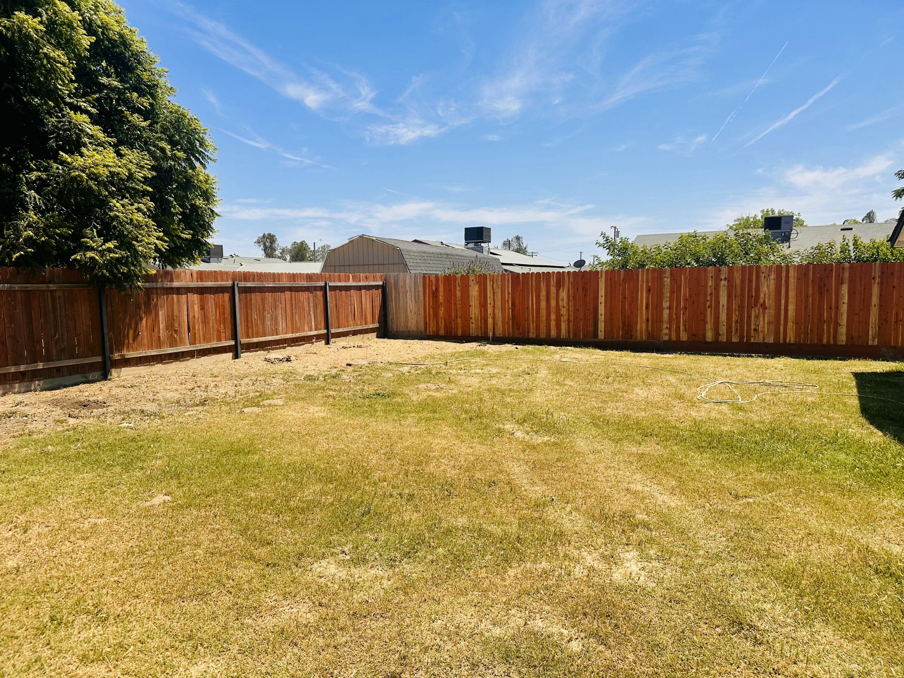 30880 Farr Road Visalia, CA 93291 - Photo 25 of 27 a view of a swimming pool with a yard