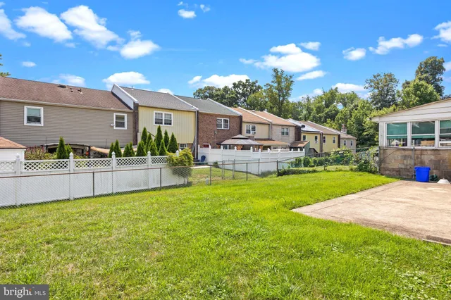 a view of a house with a yard porch and sitting area