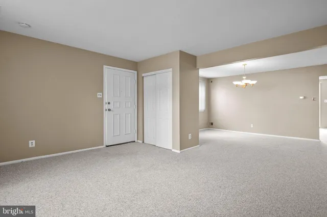 a view of an empty room with a bathroom