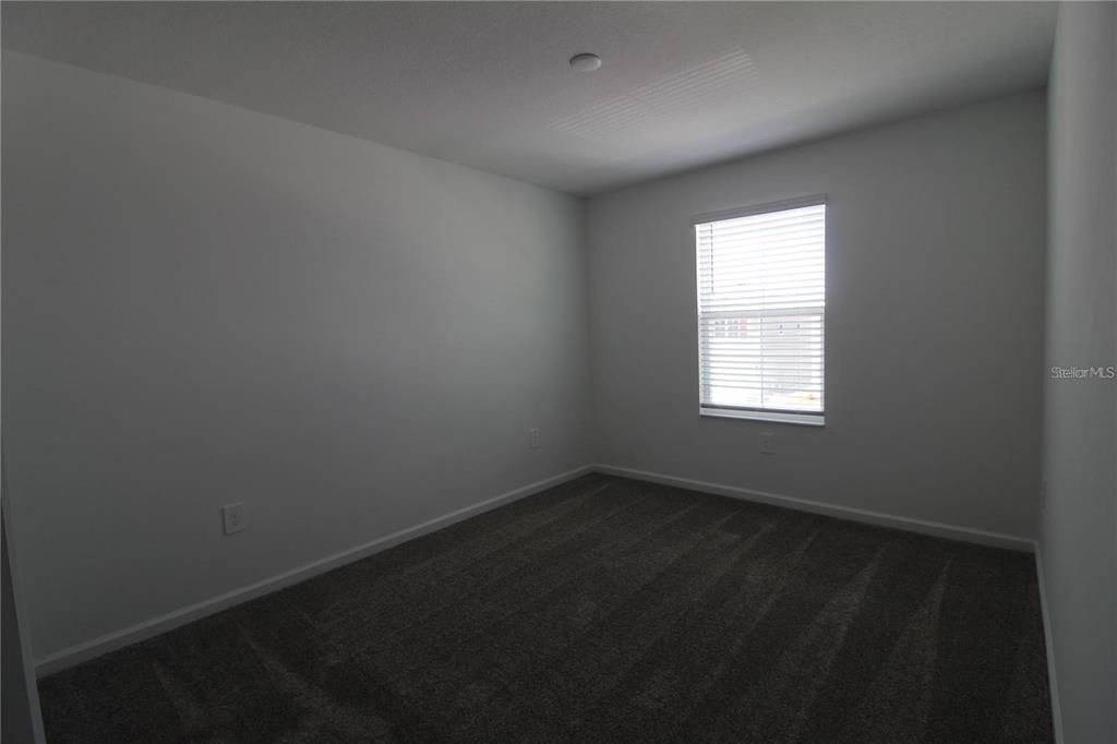263 Hayley Street Lake Wales, FL 33859 - Photo 13 of 22 an empty room with a window