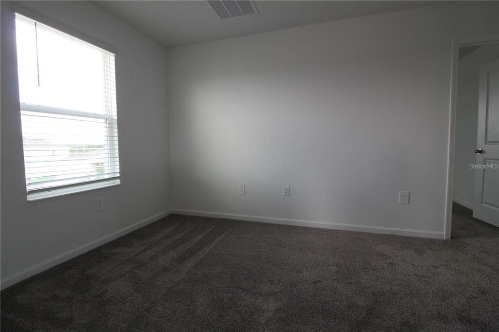 263 Hayley Street Lake Wales, FL 33859 - Photo 14 of 22 an empty room with a window
