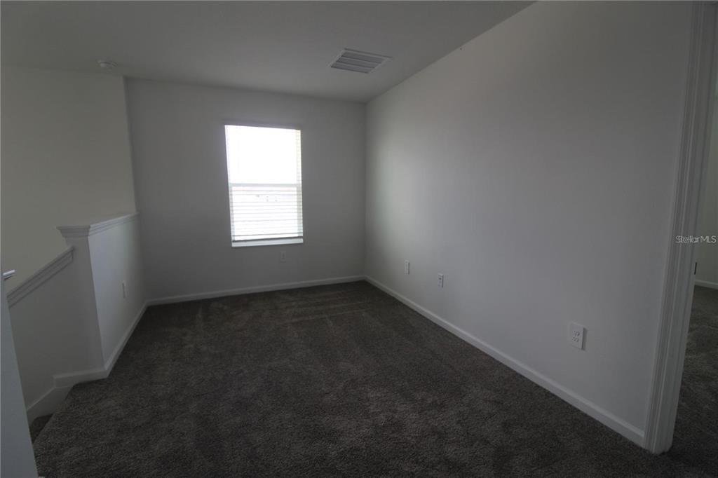 263 Hayley Street Lake Wales, FL 33859 - Photo 15 of 22 an empty room with a window