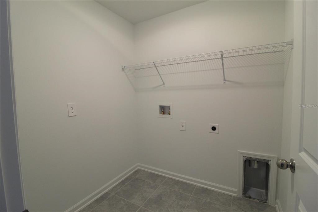 263 Hayley Street Lake Wales, FL 33859 - Photo 16 of 22 a view of a room with racks on the wall