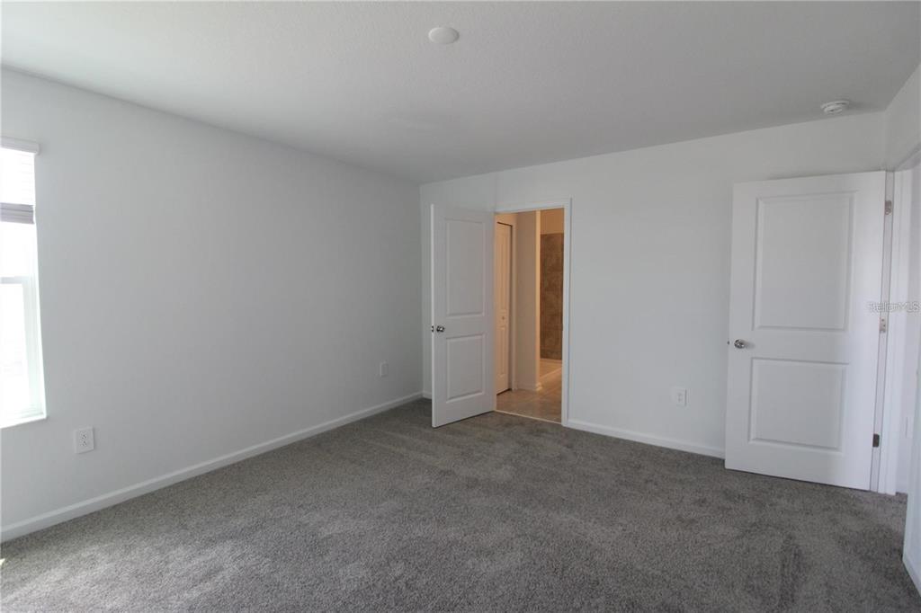 263 Hayley Street Lake Wales, FL 33859 - Photo 8 of 22 a view of an empty room and a window