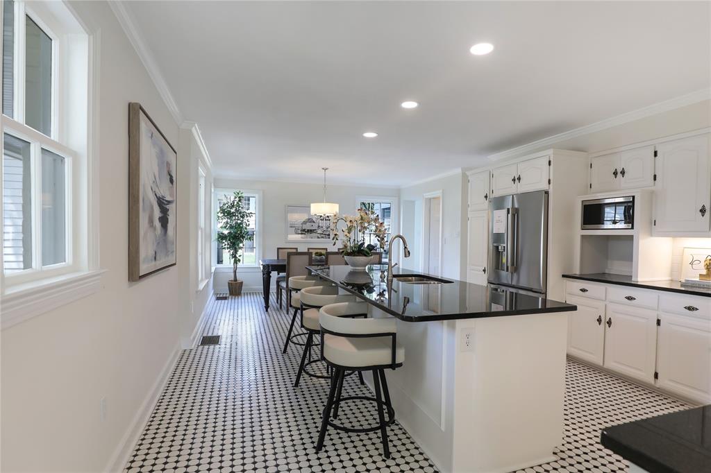 1102 Howell Street McKinney, TX 75069 - Photo 12 of 40 This move-in ready gem has an updated kitchen, brand new refrigerator (included), Bosch five-burner gas range, granite counters, oversize breakfast area, and walk-in pantry.