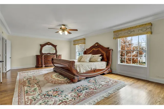 a view of a dining room with furniture windows and wooden floor