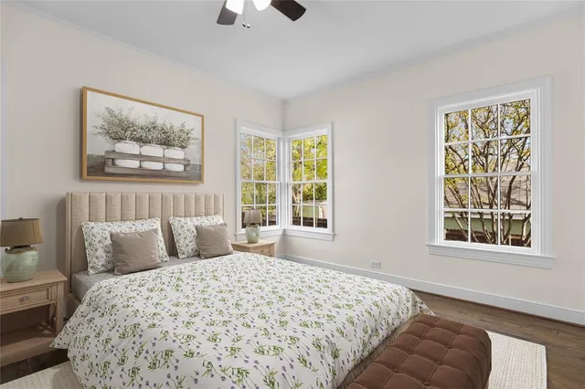 a bedroom with bed and a window