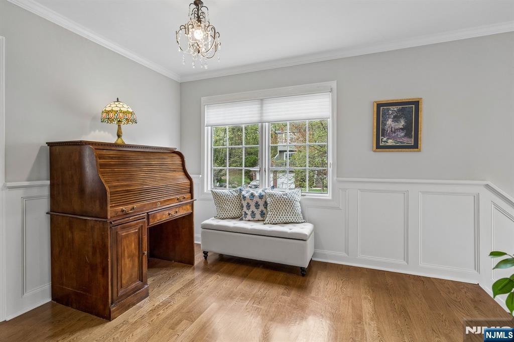1 Beekman Hill Road Caldwell, NJ 07006 - Photo 24 of 37 a bedroom with a bed and a chandelier