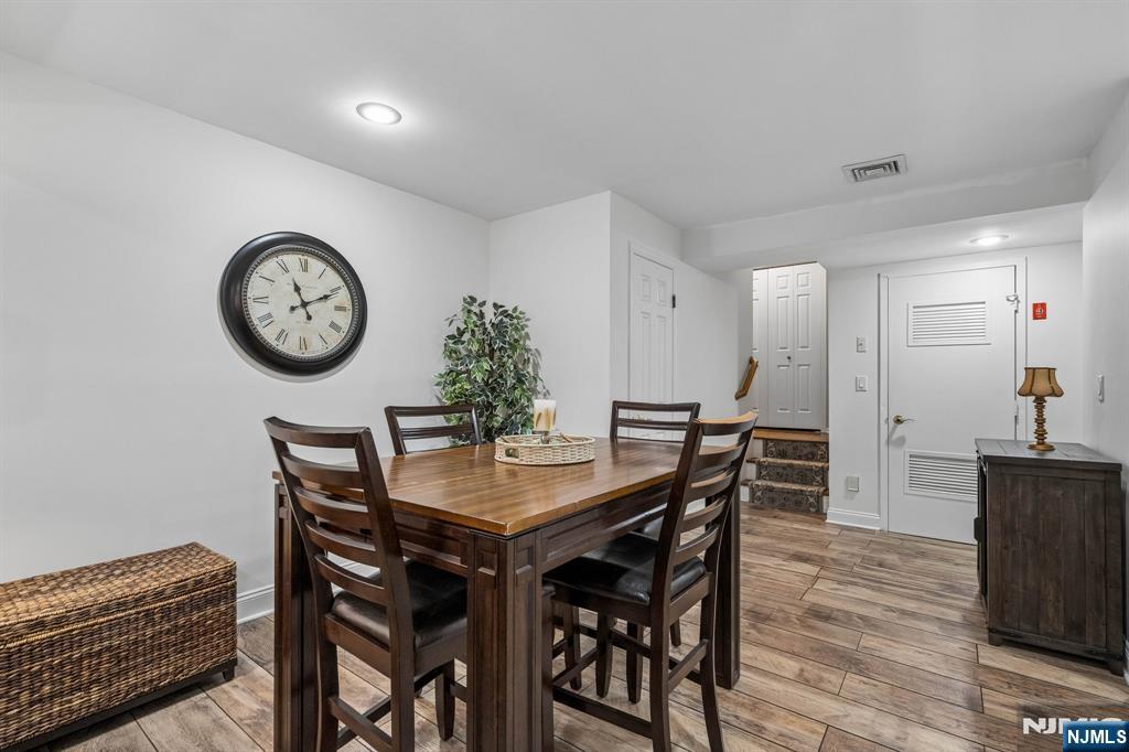 1 Beekman Hill Road Caldwell, NJ 07006 - Photo 27 of 37 a view of a dining area with furniture and wooden floor