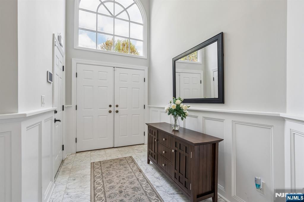 1 Beekman Hill Road Caldwell, NJ 07006 - Photo 3 of 37 a view of hallway with mirror