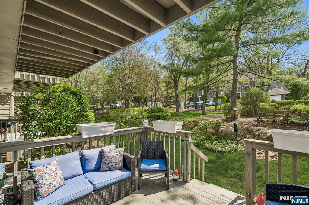 1 Beekman Hill Road Caldwell, NJ 07006 - Photo 36 of 37 a balcony with wooden floor and outdoor seating