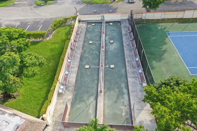 an aerial view of a residential houses with outdoor space