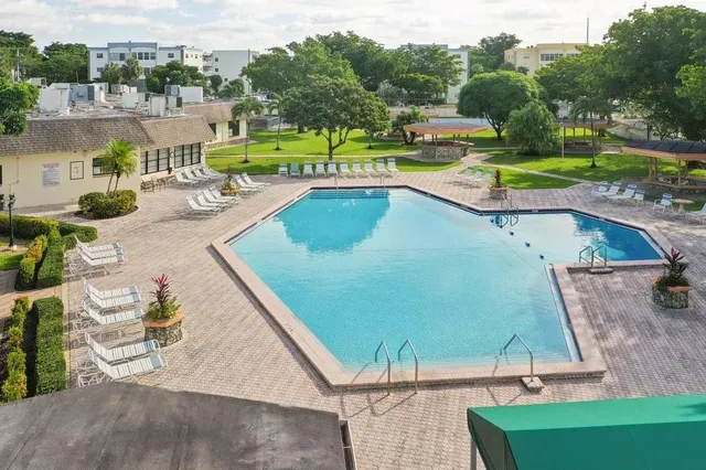 an aerial view of a house with a swimming pool