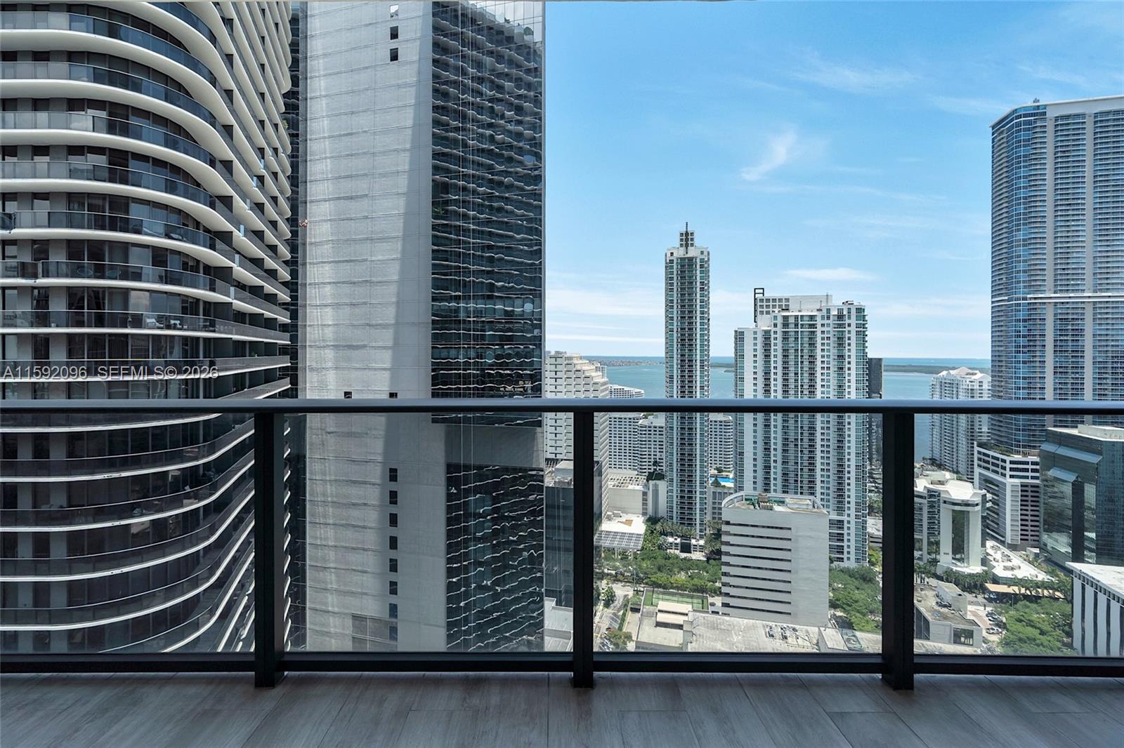 45 Southwest 9th Street, Unit 3502 Miami, FL 33130 - Photo 16 of 46 a view of balcony with two chairs and a window