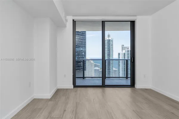 an empty room with wooden floor