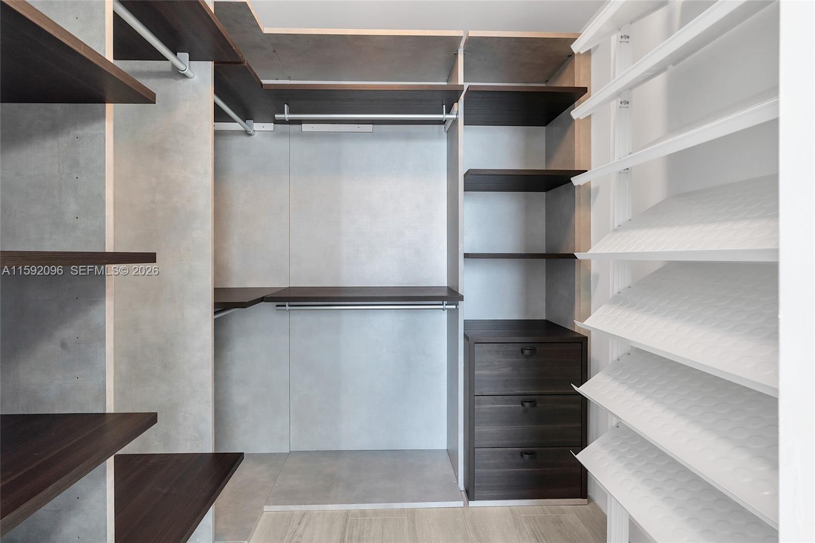 45 Southwest 9th Street, Unit 3502 Miami, FL 33130 - Photo 27 of 46 a view of walk in closet with empty racks