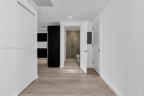 a view of entryway with wooden floor