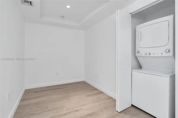 an empty room with wooden floor
