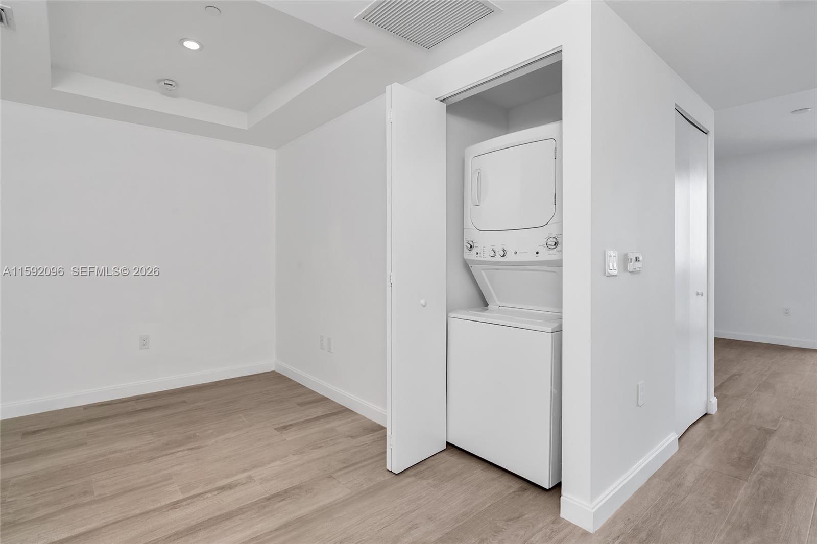 45 Southwest 9th Street, Unit 3502 Miami, FL 33130 - Photo 38 of 46 an empty room with wooden floor