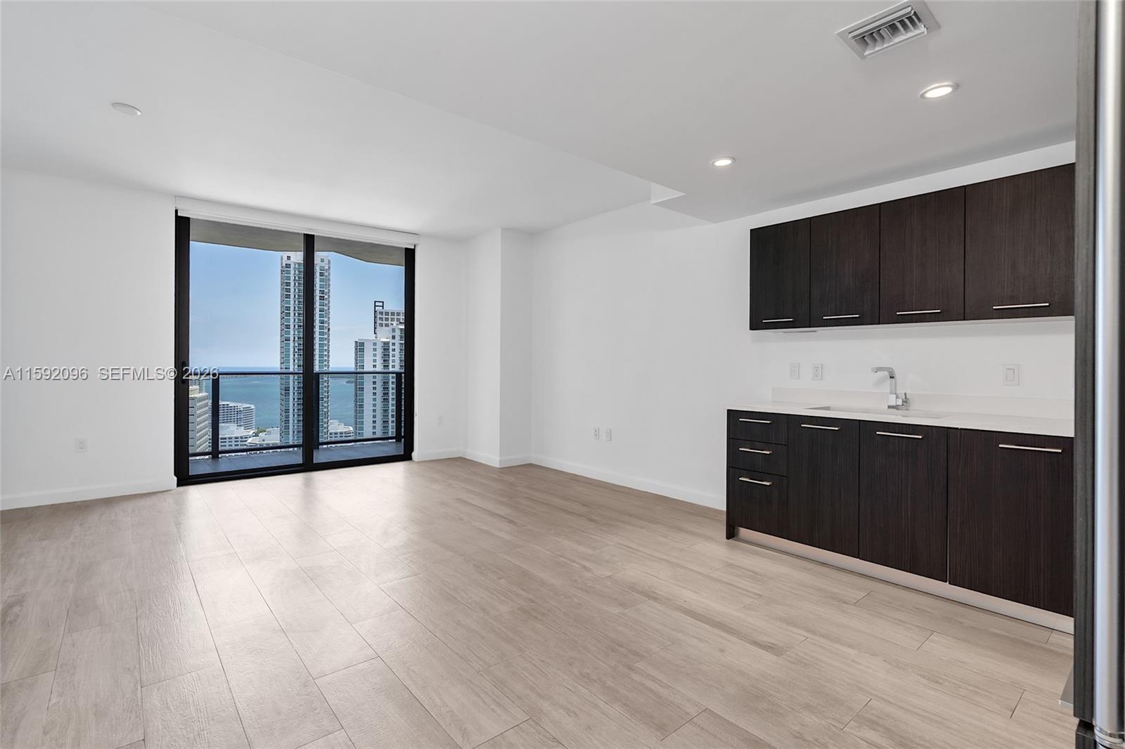 45 Southwest 9th Street, Unit 3502 Miami, FL 33130 - Photo 7 of 46 a living room with a flat screen tv
