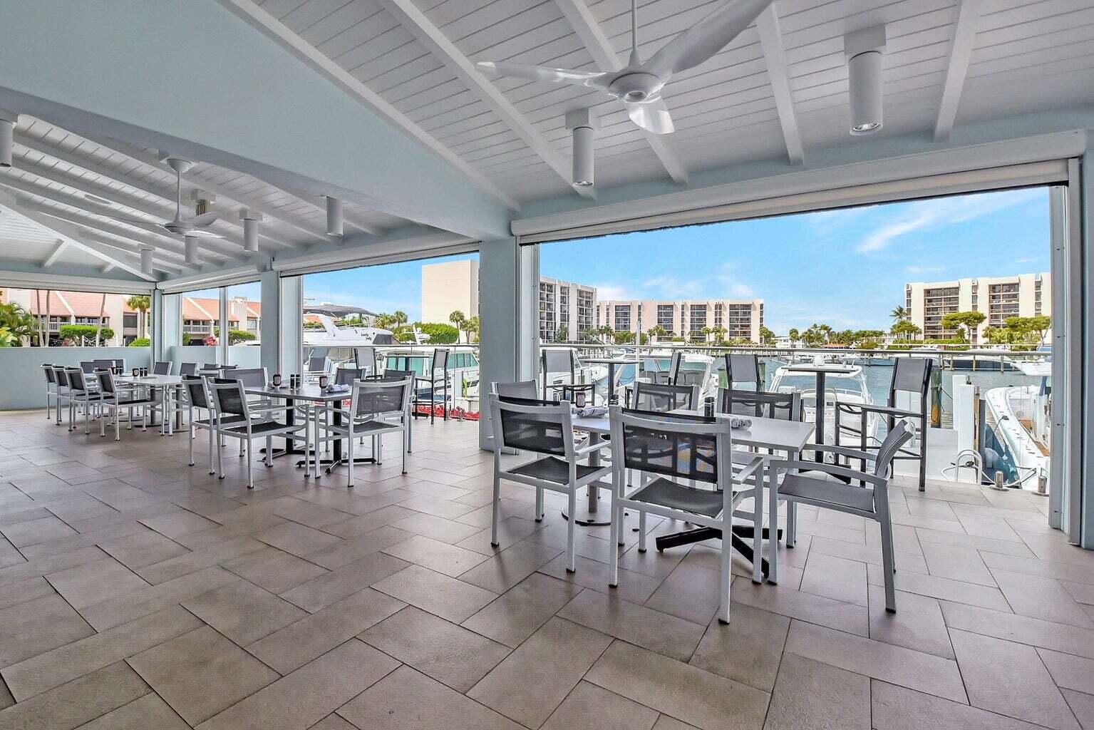 2707 North Ocean Boulevard, Unit D205 Boca Raton, FL 33431 - Photo 33 of 51 a outdoor space with lots of chairs a table and chairs