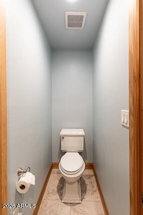 6233 West Airport Road Willcox, AZ 85643 - Photo 27 of 54 a white toilet sitting next to a shower