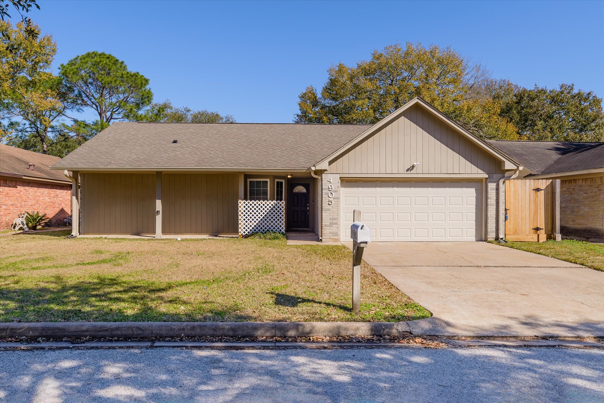 4905 Woodway Avenue Rosenberg, TX 77471 - Photo 1 of 30 a front view of a house with garden