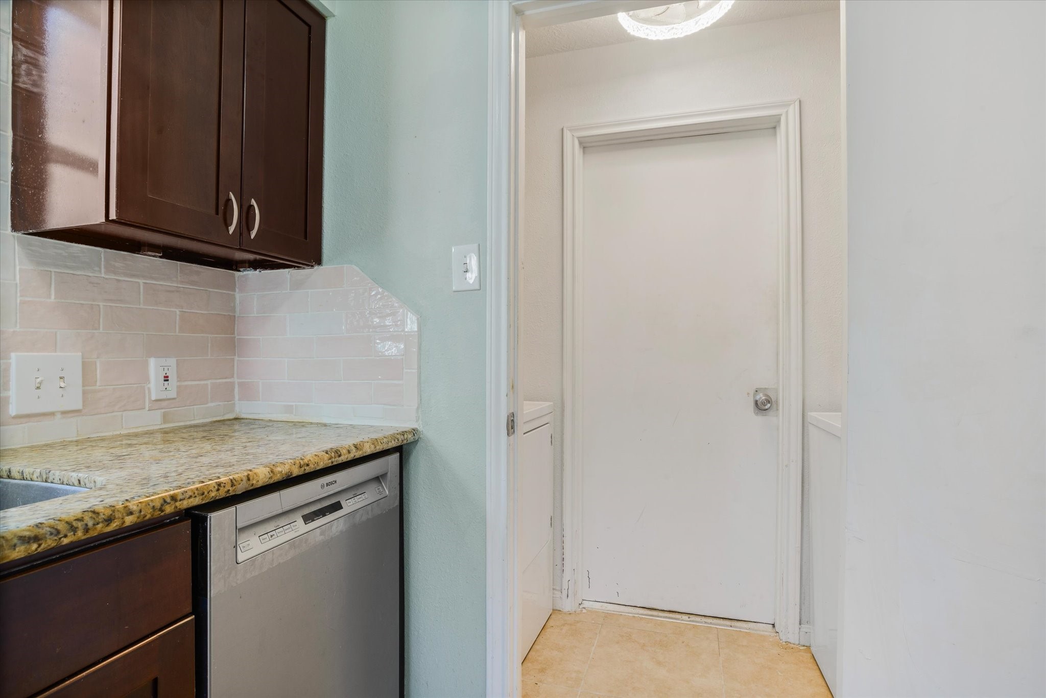 4905 Woodway Avenue Rosenberg, TX 77471 - Photo 12 of 30 a bathroom with a granite countertop sink and a mirror