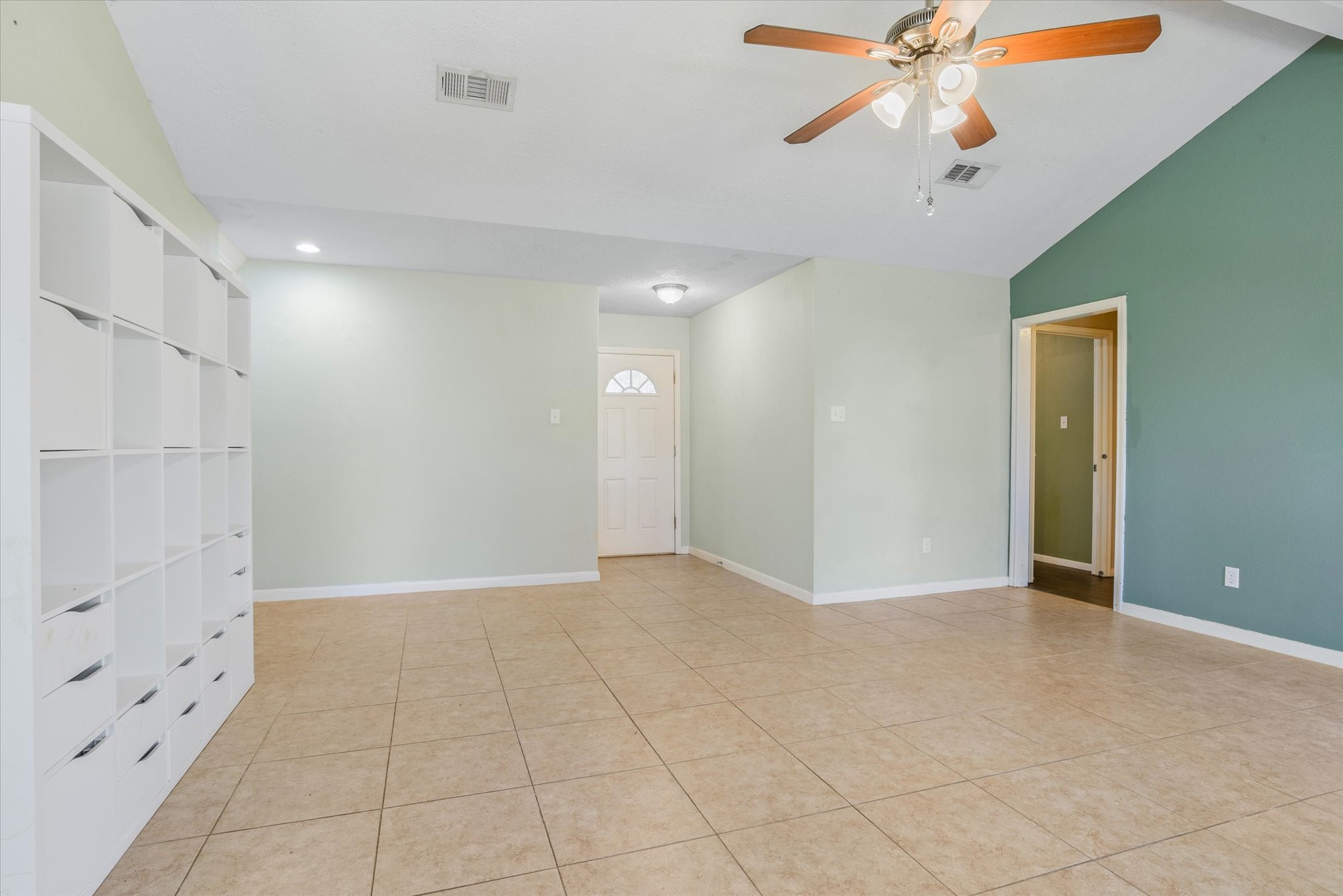 4905 Woodway Avenue Rosenberg, TX 77471 - Photo 8 of 30 an empty room with chandelier fan and windows