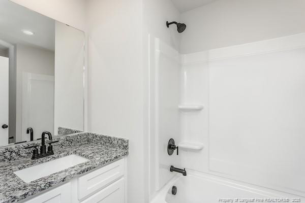 29 Laforce Lane Broadway, NC 27505 - Photo 11 of 11 a bathroom with a granite countertop sink and a mirror