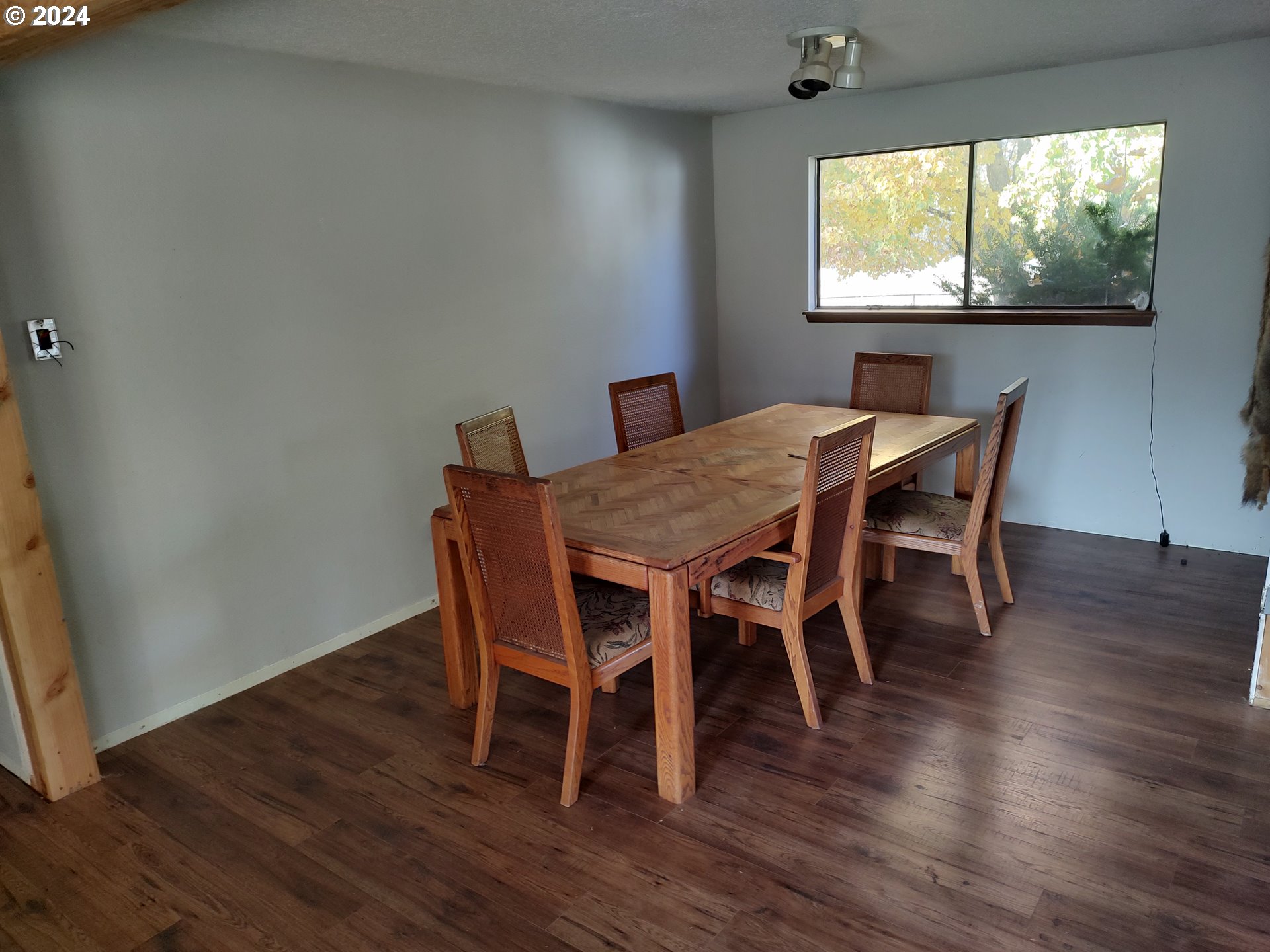 75657 Upper Diamond Lane Wallowa, OR 97885 - Photo 14 of 21 a dining room with furniture window and wooden floor