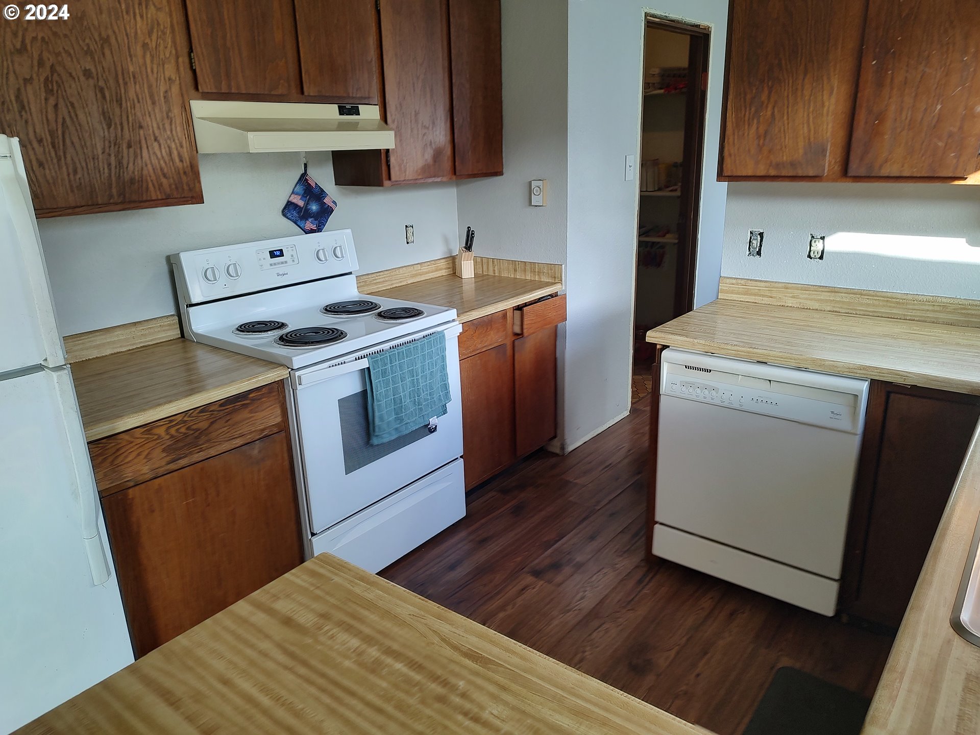 75657 Upper Diamond Lane Wallowa, OR 97885 - Photo 17 of 21 a kitchen with a stove top oven sink and cabinets