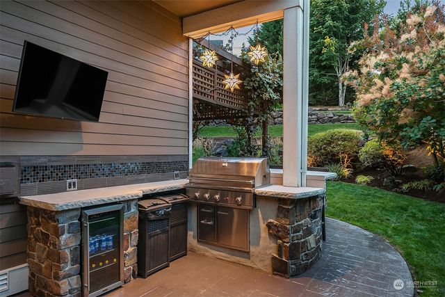 a view of a patio with a table and chairs