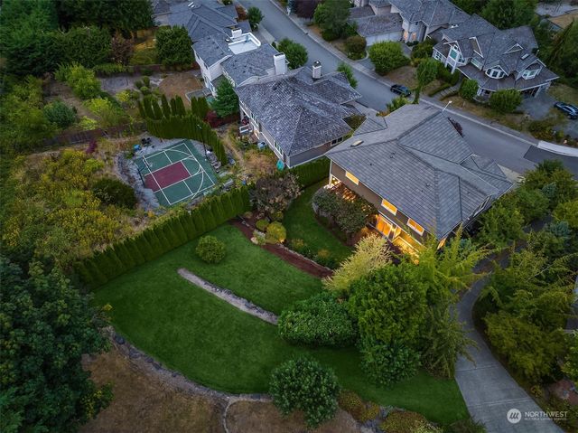 an aerial view of house with yard