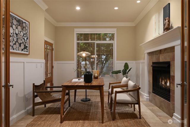 a dining room with furniture and window