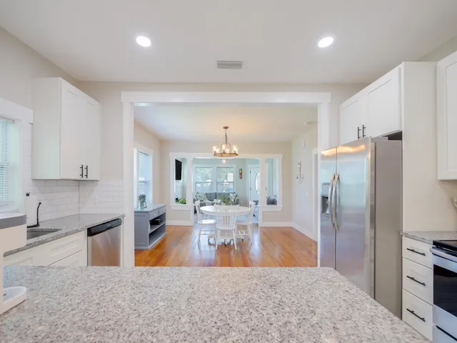 a view of a kitchen and dining room