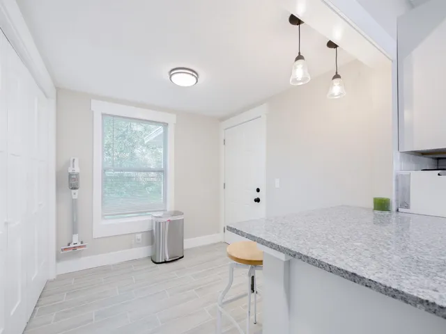 a kitchen with a sink a window and stainless steel appliances