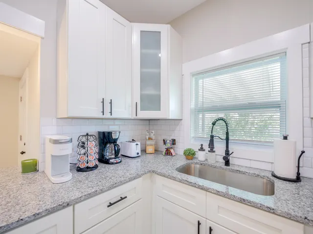 a kitchen with sink and window
