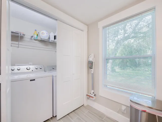 a view of storage and utility room with washer and dryer