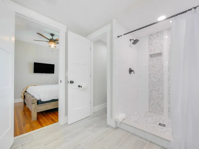 a bathroom with a shower and a sink